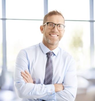 Attorney holding a mug and sitting at computer